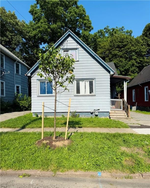 188 5th St, Rochester, NY 14605 - view of front of house featuring covered porch and a front lawn