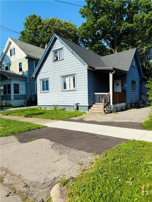 188 5th St, Rochester, NY 14605 - bungalow-style house with roof with shingles and covered porch