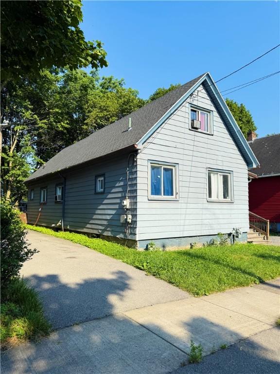 188 5th St, Rochester, NY 14605 - view of side of home featuring a shingled roof