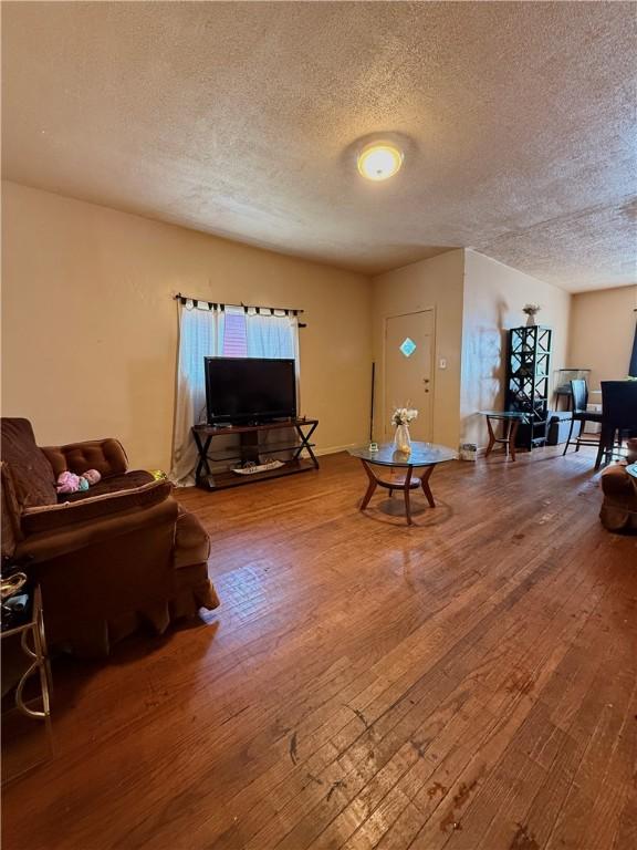 188 5th St, Rochester, NY 14605 - living room with a textured ceiling and hardwood / wood-style flooring