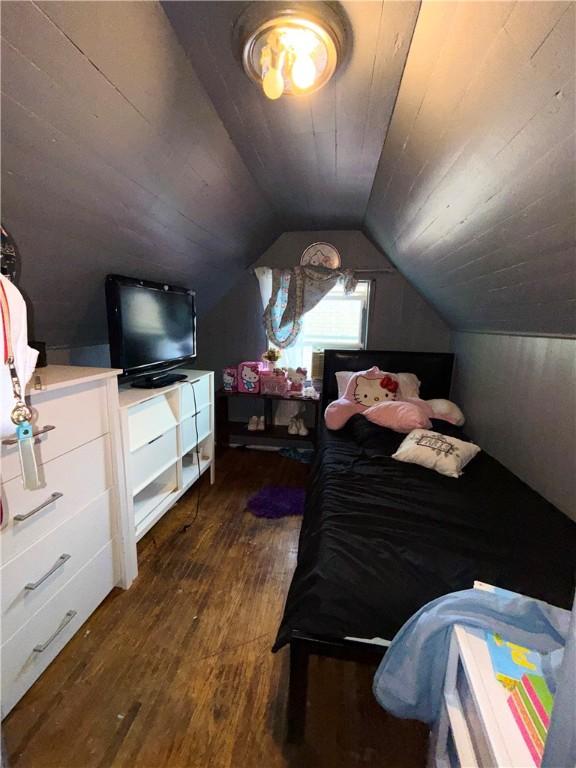 188 5th St, Rochester, NY 14605 - bedroom featuring dark wood-style flooring, vaulted ceiling, and wood ceiling
