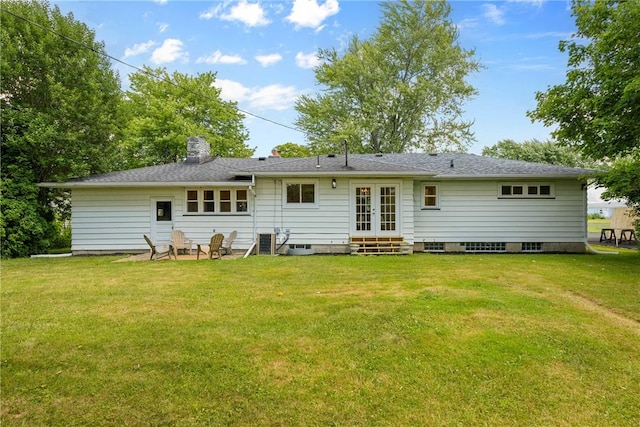 33 W Crest Dr, Gates, NY 14606 - rear view of house with french doors, a yard, a chimney, and entry steps