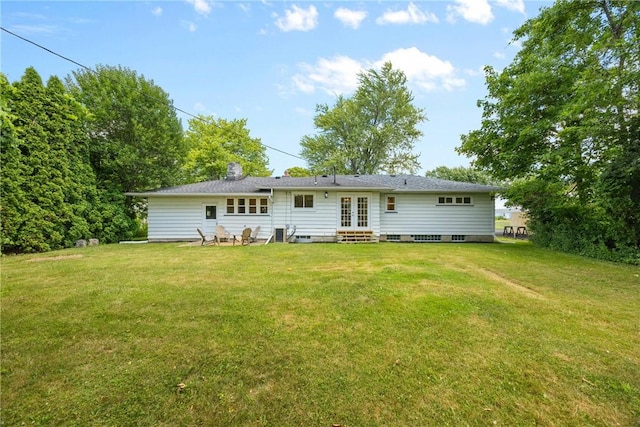 33 W Crest Dr, Gates, NY 14606 - back of property with french doors, entry steps, and a yard