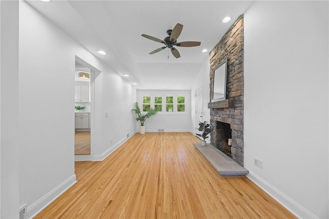 33 W Crest Dr, Gates, NY 14606 - unfurnished living room featuring a fireplace, ceiling fan, light wood-style flooring, and recessed lighting