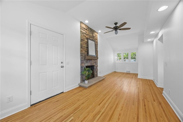 33 W Crest Dr, Gates, NY 14606 - unfurnished living room with a ceiling fan, a fireplace, light wood-style flooring, recessed lighting, and vaulted ceiling