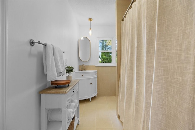 33 W Crest Dr, Gates, NY 14606 - full bath featuring vanity, tile patterned flooring, and a shower with curtain