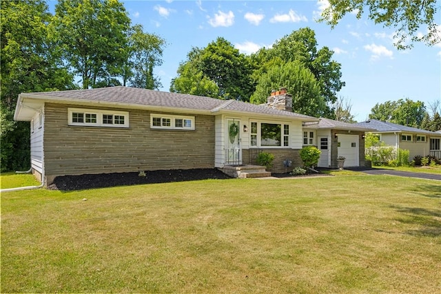 33 W Crest Dr, Gates, NY 14606 - view of front of property featuring a chimney, asphalt driveway, a garage, and a front yard