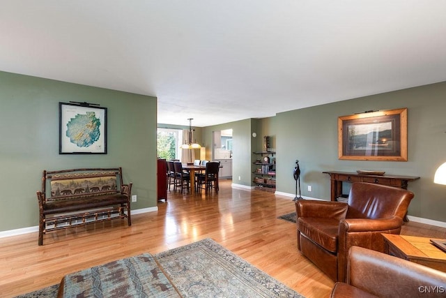 117 Shoreview Dr, Clay, NY 13090 - living area featuring light wood finished floors and a chandelier
