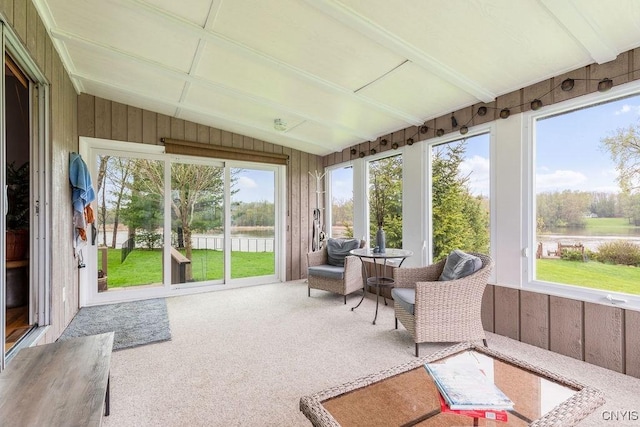 117 Shoreview Dr, Clay, NY 13090 - sunroom / solarium with a water view, lofted ceiling, carpet flooring, and wooden walls
