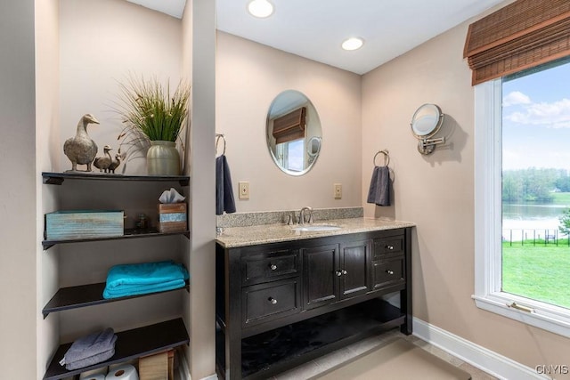 117 Shoreview Dr, Clay, NY 13090 - bathroom with vanity, healthy amount of natural light, a water view, and recessed lighting