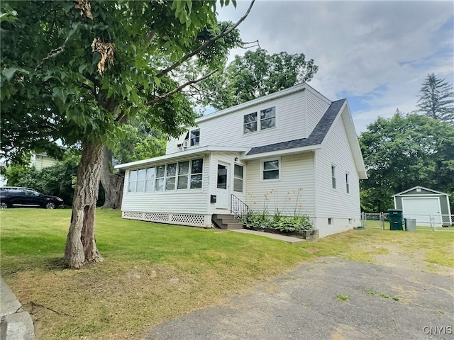 313 Chestnut St, Oswego, NY 13126 - view of front of house with entry steps, roof with shingles, crawl space, driveway, and an outdoor structure
