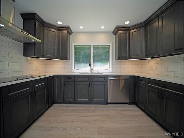 213 Bradshaw Rd, Dryden, NY 13053 - kitchen with dishwasher, wall chimney range hood, black electric cooktop, light wood finished floors, and light countertops