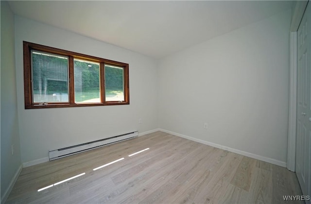 213 Bradshaw Rd, Dryden, NY 13053 - spare room featuring baseboard heating and light wood finished floors