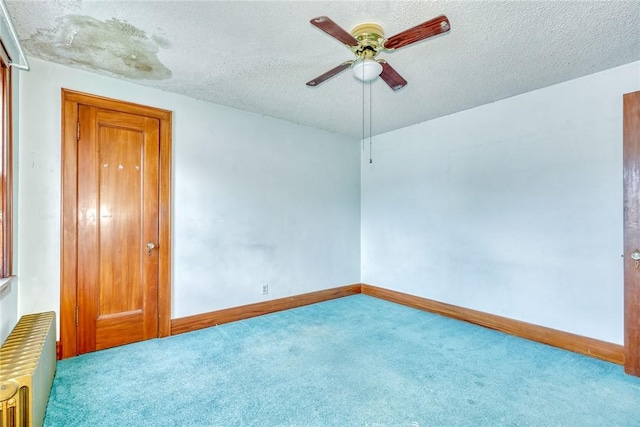 112 Isabelle St, Rochester, NY 14606 - carpeted spare room featuring radiator, a ceiling fan, and a textured ceiling