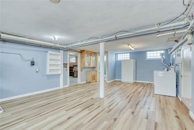 112 Isabelle St, Rochester, NY 14606 - below grade area featuring wood finished floors and washing machine and clothes dryer