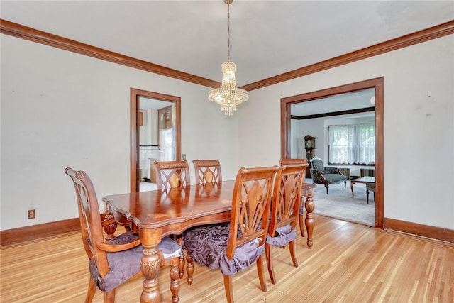 112 Isabelle St, Rochester, NY 14606 - dining room with a chandelier, crown molding, and light wood-style floors