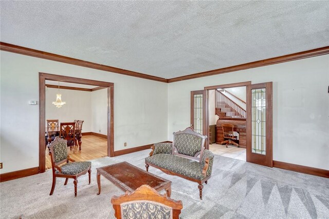 112 Isabelle St, Rochester, NY 14606 - living room featuring crown molding, carpet floors, french doors, a chandelier, and a textured ceiling