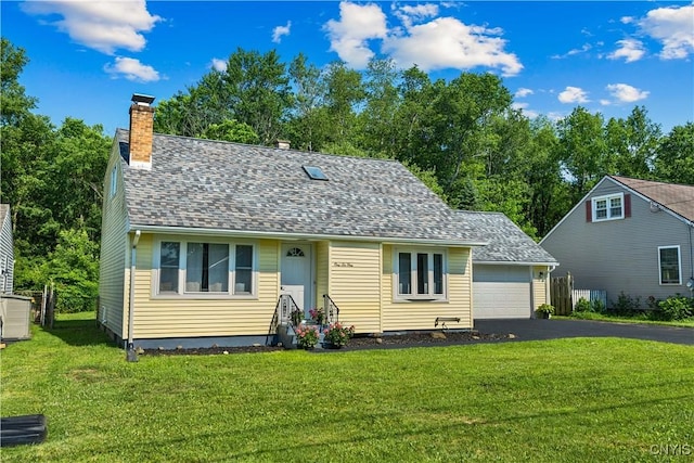 161 Forrest St, Deerfield, NY 13502 - view of front of home featuring a chimney, a front lawn, and driveway