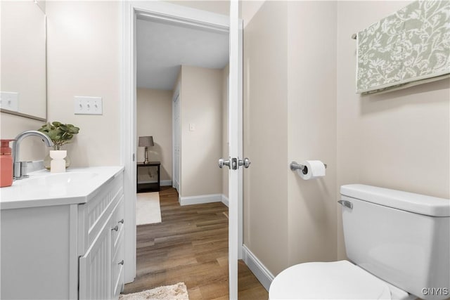 161 Forrest St, Deerfield, NY 13502 - half bathroom with vanity and wood finished floors