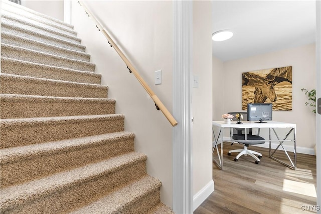 161 Forrest St, Deerfield, NY 13502 - stairway featuring baseboards and wood finished floors