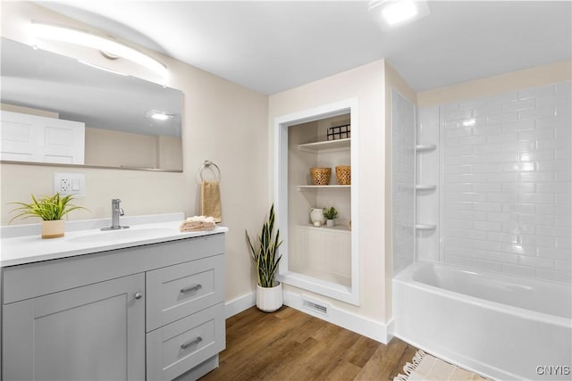 161 Forrest St, Deerfield, NY 13502 - bathroom featuring vanity, wood finished floors, and washtub / shower combination