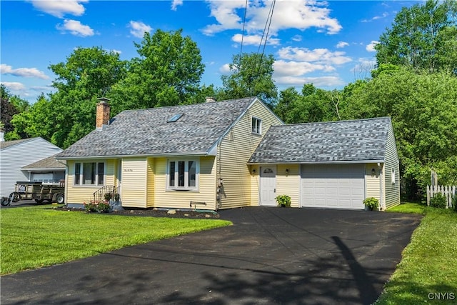 161 Forrest St, Deerfield, NY 13502 - view of front facade with driveway, a garage, a front yard, a chimney, and a shingled roof