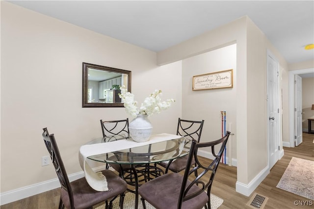 161 Forrest St, Deerfield, NY 13502 - dining space with baseboards and wood finished floors