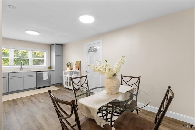 161 Forrest St, Deerfield, NY 13502 - dining room featuring light wood-style flooring and baseboards