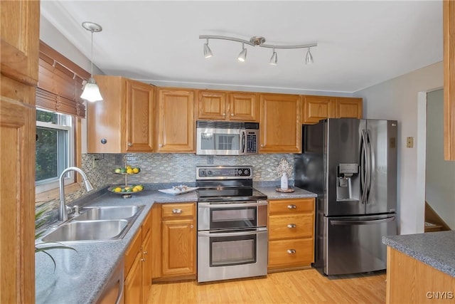 3675 Buttercup Ln, Clay, NY 13027 - kitchen with stainless steel appliances, light wood finished floors, and decorative backsplash