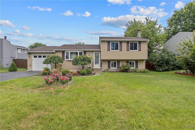 3675 Buttercup Ln, Clay, NY 13027 - split level home with a garage, driveway, a chimney, and a front lawn