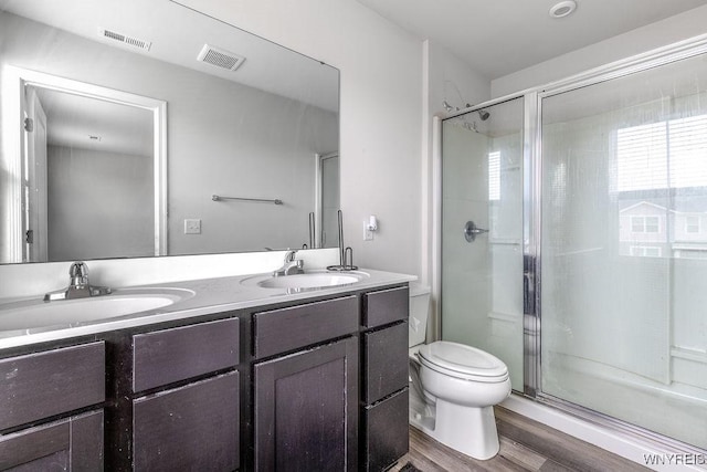 52 Winterbrook Dr, Amherst, NY 14228 - full bathroom with double vanity, a stall shower, and wood finished floors