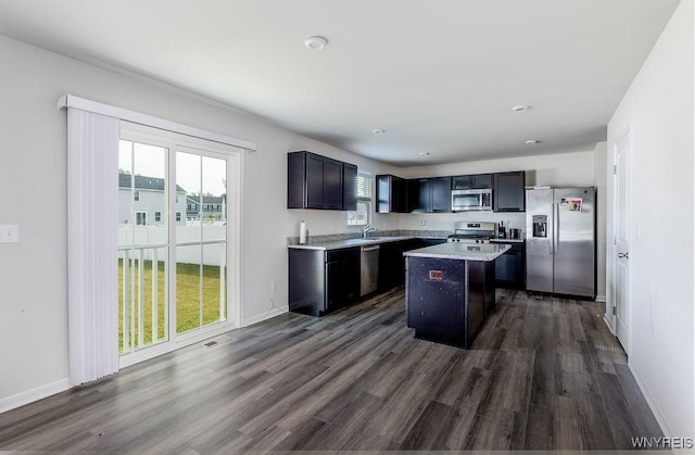 52 Winterbrook Dr, Amherst, NY 14228 - kitchen with stainless steel appliances, dark wood finished floors, light countertops, and a kitchen island