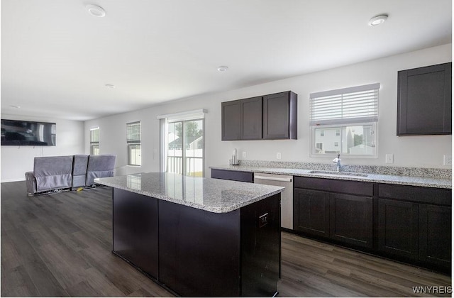 52 Winterbrook Dr, Amherst, NY 14228 - kitchen with dishwasher, dark wood-style flooring, a kitchen island, light stone countertops, and open floor plan