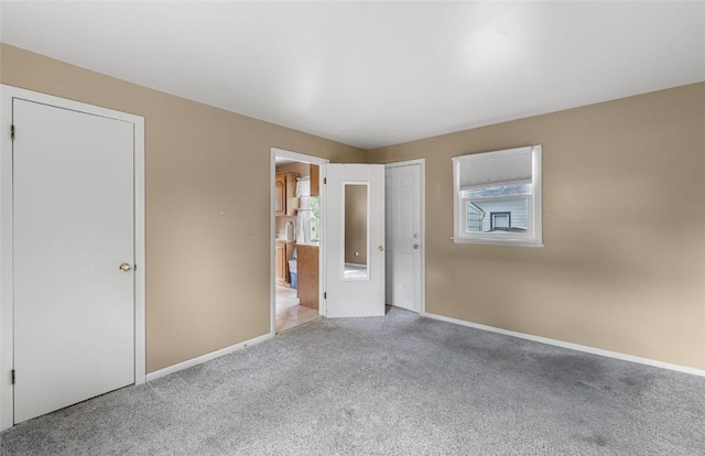 1162 Draper Ave, Elmira, NY 14905 - unfurnished bedroom featuring carpet and freestanding refrigerator