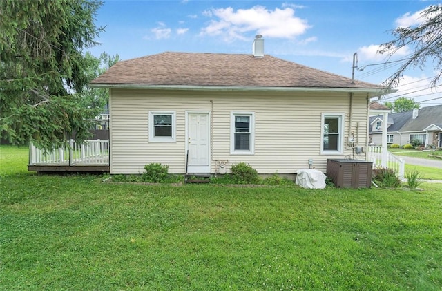1162 Draper Ave, Elmira, NY 14905 - back of house with a yard, a chimney, and a wooden deck