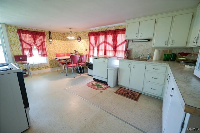 202 County Highway 25a, Richfield, NY 13439 - kitchen with stove, wallpapered walls, white dishwasher, light countertops, and tasteful backsplash