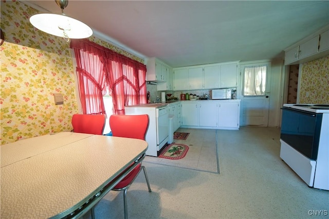 202 County Highway 25a, Richfield, NY 13439 - kitchen featuring white appliances, wallpapered walls, white cabinets, and hanging light fixtures