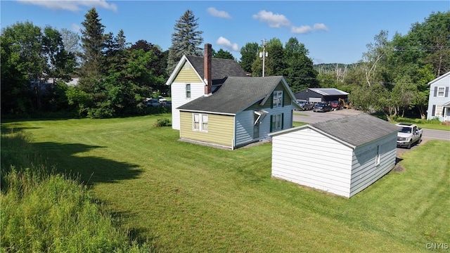 202 County Highway 25a, Richfield, NY 13439 - view of side of property featuring a lawn, a chimney, and roof with shingles