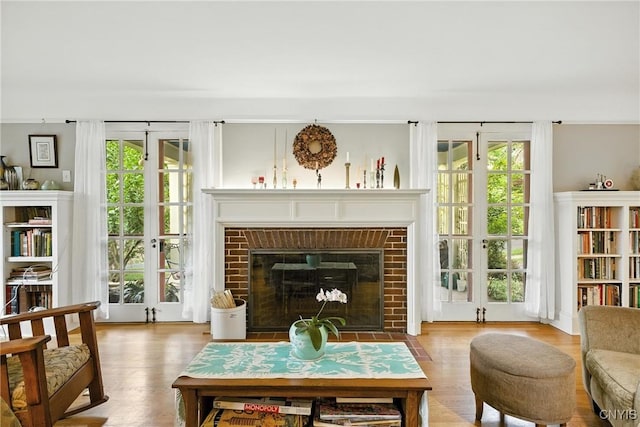306 Berkeley Dr, Syracuse, NY 13210 - living room featuring wood finished floors and a fireplace