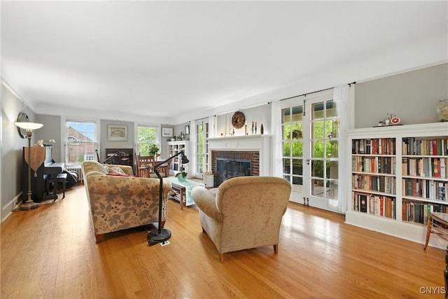 306 Berkeley Dr, Syracuse, NY 13210 - living area with a brick fireplace and wood finished floors