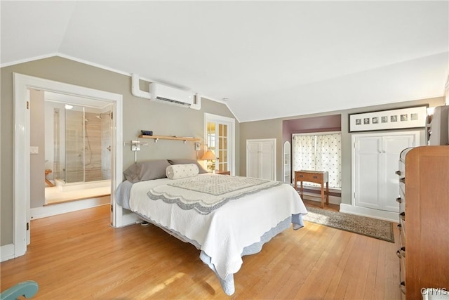 306 Berkeley Dr, Syracuse, NY 13210 - bedroom featuring vaulted ceiling, a wall unit AC, and light wood-style flooring