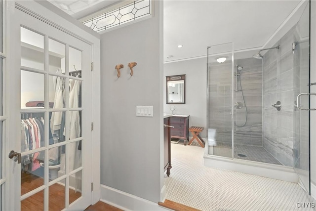 306 Berkeley Dr, Syracuse, NY 13210 - full bathroom featuring a stall shower, vanity, and french doors