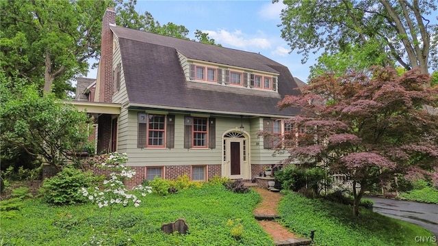 306 Berkeley Dr, Syracuse, NY 13210 - view of front of house featuring a gambrel roof and a chimney