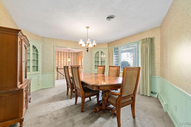 20 Cross Rd, Dewitt, NY 13224 - dining area with wainscoting, light carpet, a chandelier, wallpapered walls, and a baseboard heating unit