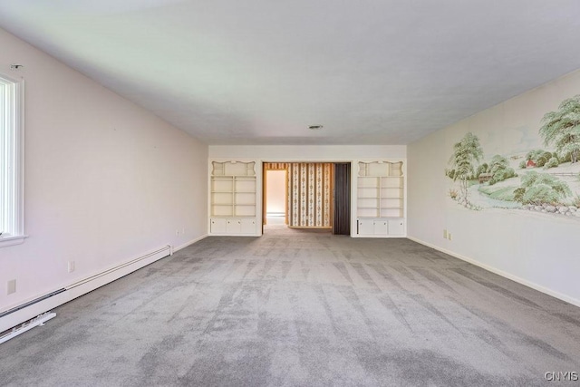 20 Cross Rd, Dewitt, NY 13224 - unfurnished living room featuring a baseboard heating unit, carpet floors, and built in shelves
