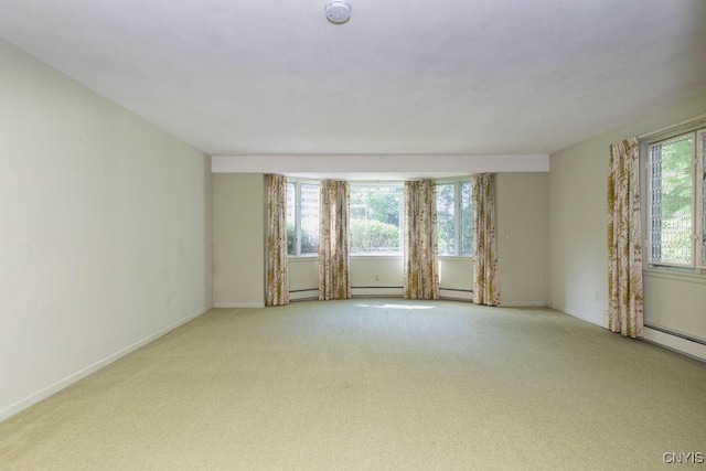 20 Cross Rd, Dewitt, NY 13224 - carpeted spare room featuring a smoke detector and baseboard heating
