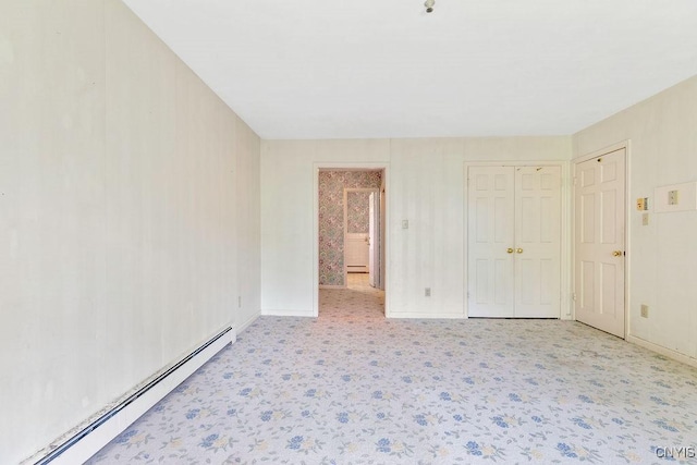 20 Cross Rd, Dewitt, NY 13224 - unfurnished bedroom with a baseboard radiator, carpet floors, and a closet