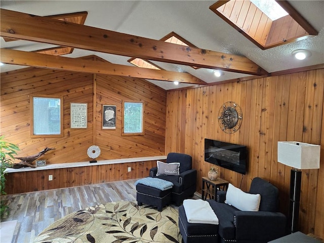 211 Steko Ave, Rochester, NY 14615 - sitting room featuring wooden walls, a skylight, and wood finished floors