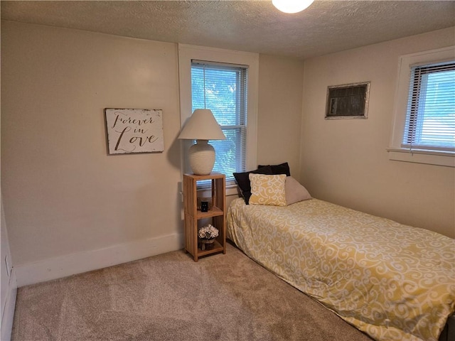 211 Steko Ave, Rochester, NY 14615 - carpeted bedroom with a textured ceiling and baseboards