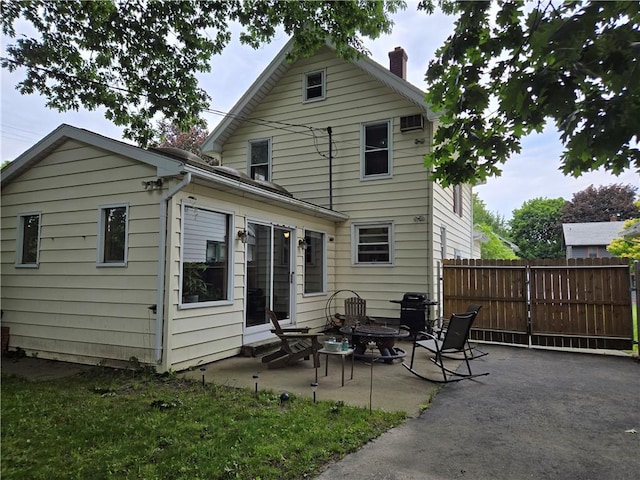 211 Steko Ave, Rochester, NY 14615 - back of house with a patio and a chimney